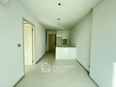 Spacious modern apartment with open kitchen layout and sleek design