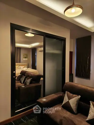 Cozy modern living room with plush seating and elegant lighting