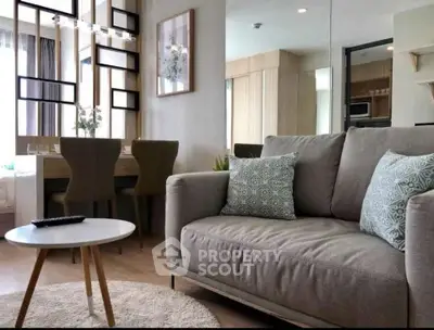 Modern living room with stylish decor and cozy seating in a contemporary apartment.