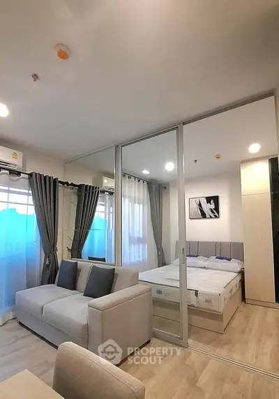 Modern studio apartment with open layout and stylish furnishings