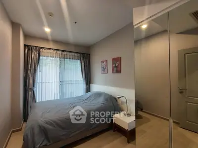 Cozy bedroom with modern decor and mirrored wardrobe