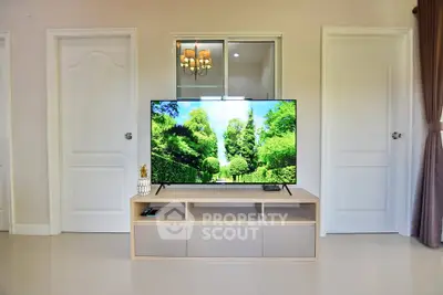 Modern living room with sleek TV setup and elegant decor