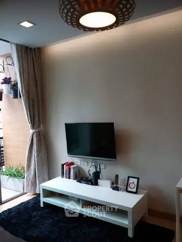 Modern living room with wall-mounted TV and stylish decor