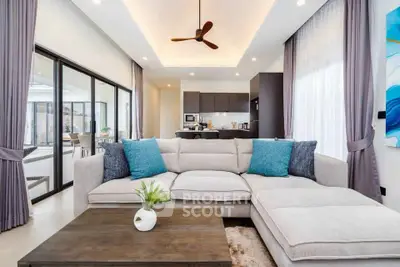 Luxurious modern living room with elegant decor and open kitchen layout