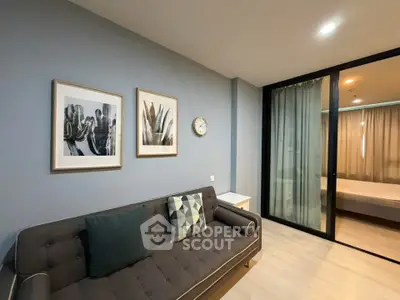 Modern living room with stylish decor and cozy ambiance in a contemporary apartment.