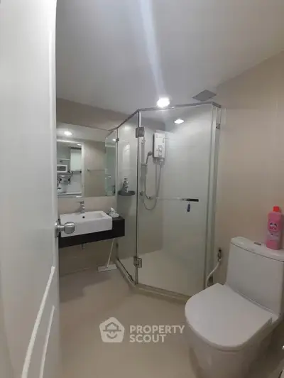 Modern bathroom with glass shower and sleek fixtures