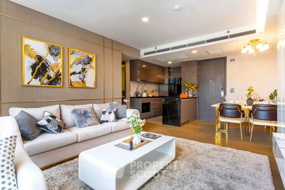 Luxurious open-plan living room with modern kitchen and elegant decor