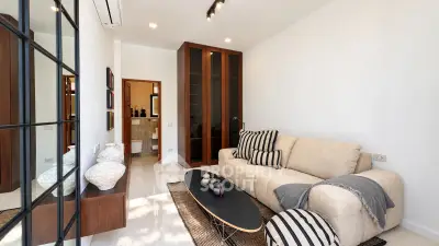 Modern living room with cozy beige sofa and stylish decor