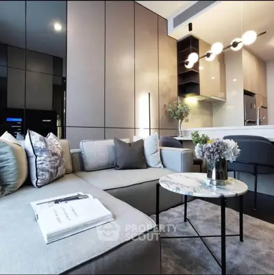 Modern living room with sleek design and open kitchen layout