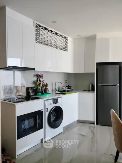 Modern kitchen with sleek appliances and stylish cabinetry