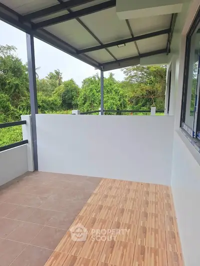 Spacious balcony with lush green views and modern design