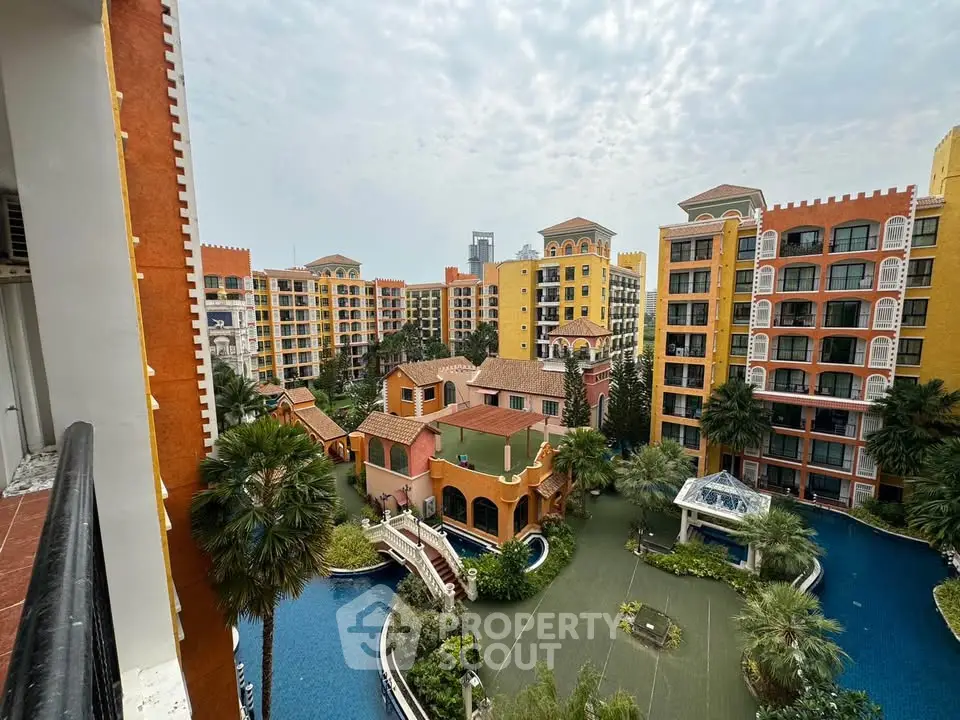 Stunning view of colorful residential complex with lush gardens and serene water features.