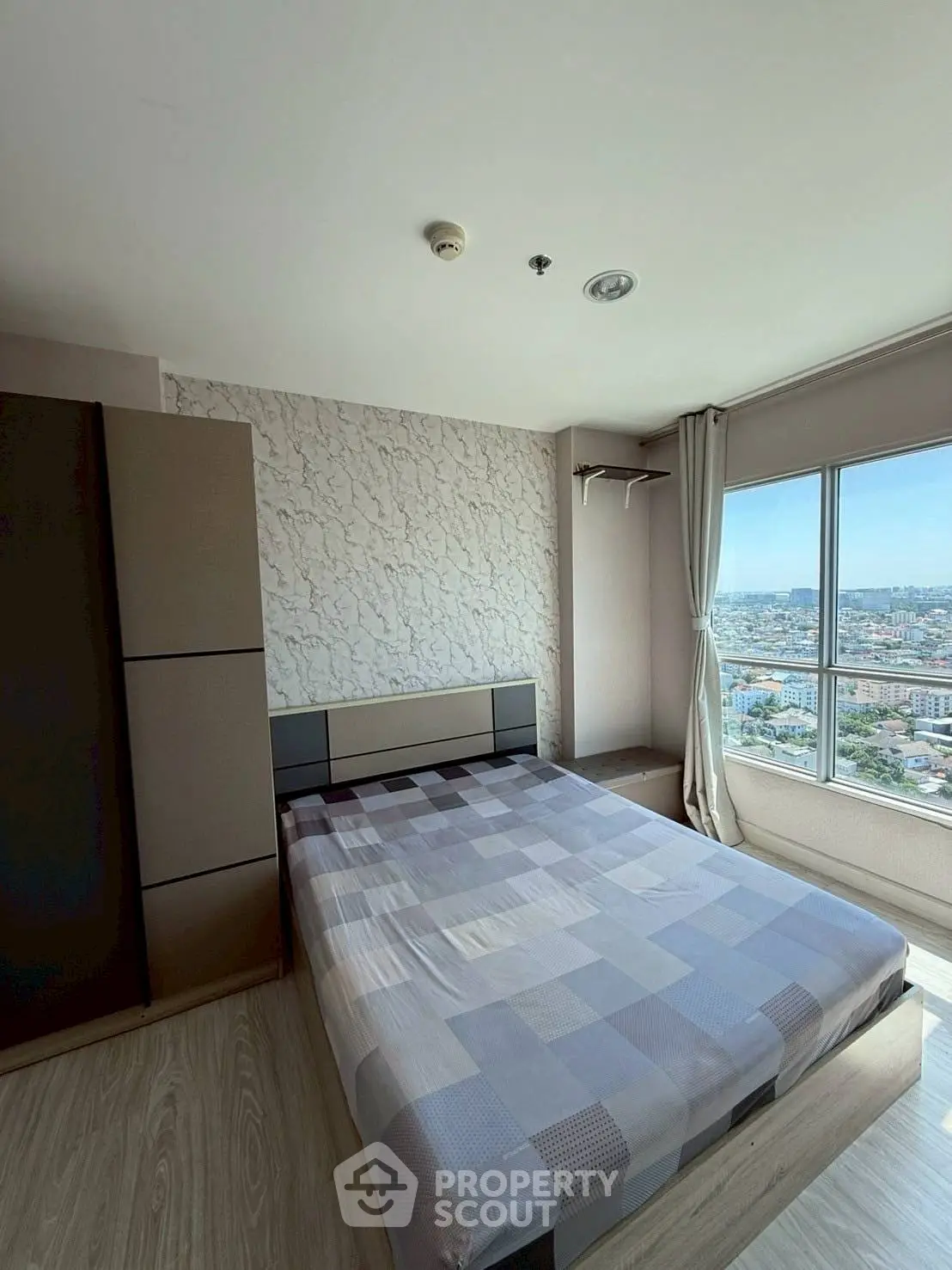 Modern bedroom with city view and stylish decor