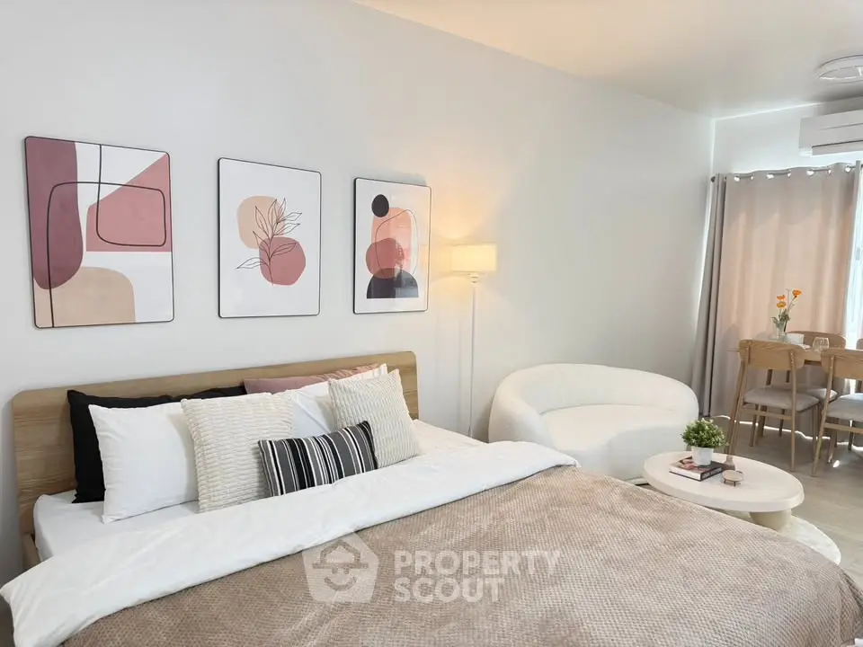 Modern bedroom with stylish decor and cozy seating area