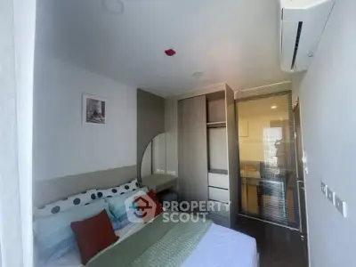 Modern bedroom with stylish decor and air conditioning in a contemporary apartment.