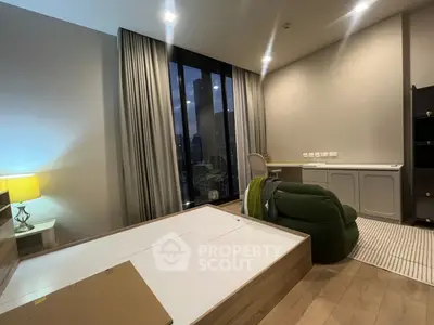 Modern bedroom with city view, featuring stylish furniture and ambient lighting.