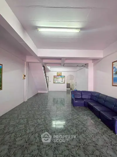 Spacious living room with marble flooring and modern decor
