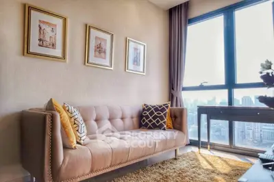 Chic living room with plush sofa and city view, perfect for urban living.