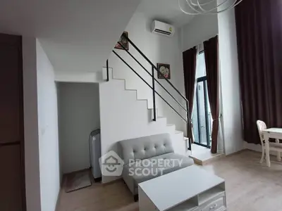 Modern duplex living room with high ceilings and stylish decor