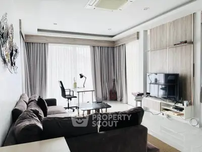 Spacious modern living room with large windows and stylish decor