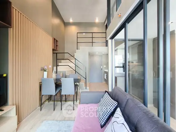 Modern duplex living room with high ceilings and stylish decor