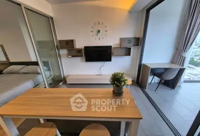 Modern studio apartment with open layout and balcony view