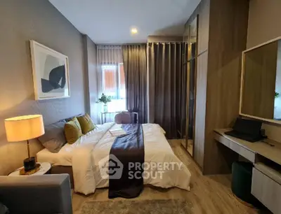 Modern bedroom with stylish decor and ample natural light