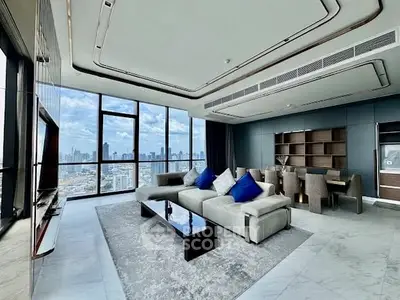 Luxurious modern living room with panoramic city views and elegant decor.