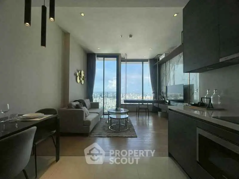 Modern living room with stunning city view and sleek kitchen design