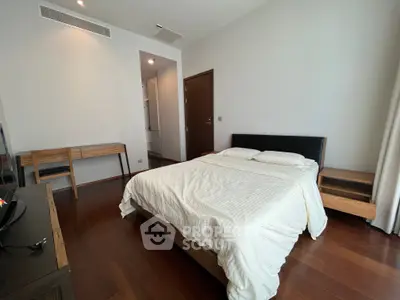 Spacious bedroom with modern wooden furniture and cozy ambiance