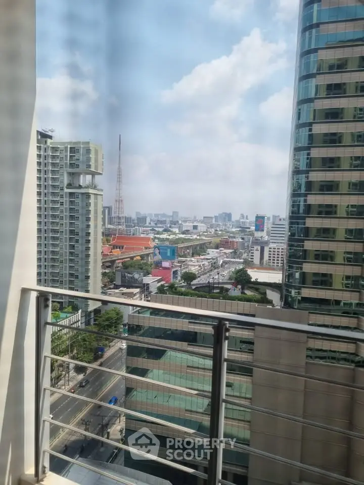 Stunning city view from a modern balcony in a high-rise building, perfect for urban living.