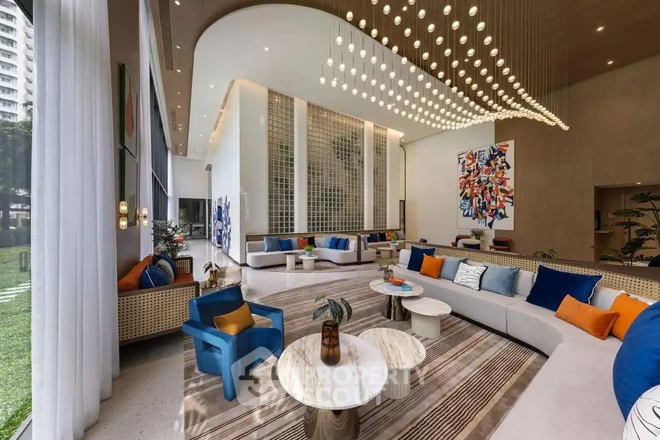 Luxurious modern living room with high ceilings, elegant lighting, and stylish decor in a spacious open layout.