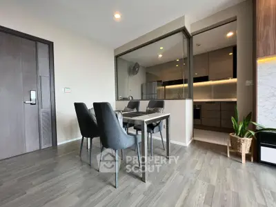 Modern dining area with sleek kitchen and stylish decor