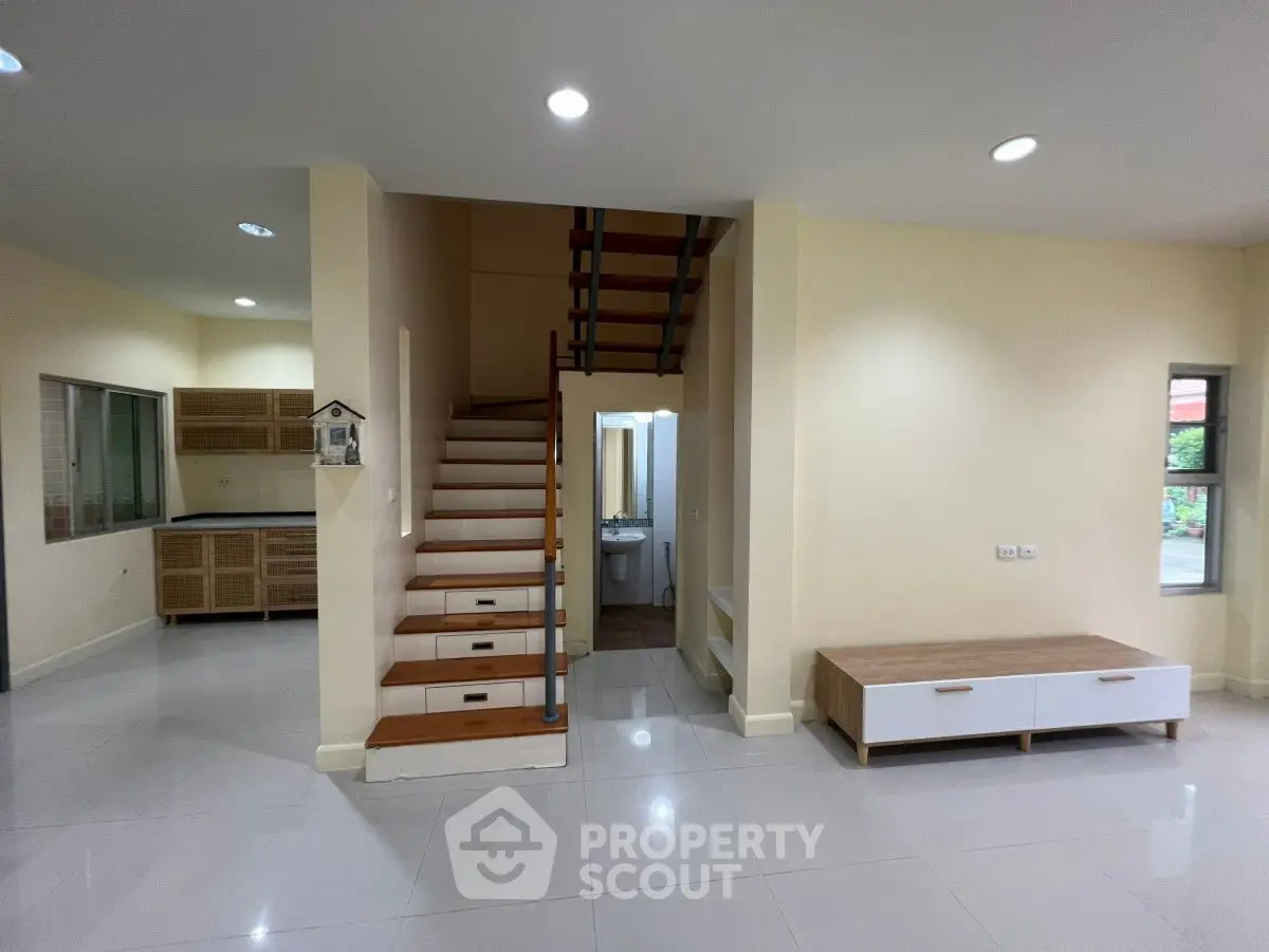 Spacious modern interior with open layout and stylish staircase, perfect for contemporary living.