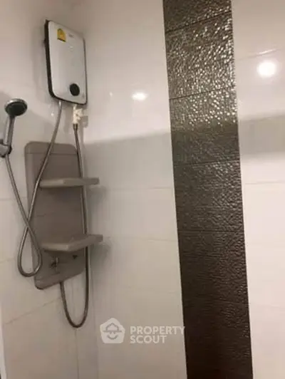 Modern bathroom with sleek shower and elegant tile design