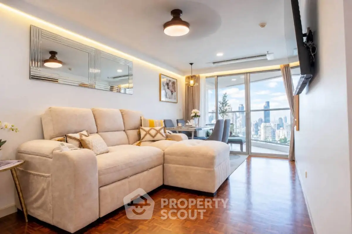Luxurious living room with modern decor and stunning city view from large windows.