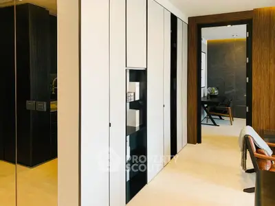 Modern interior with sleek storage and study area, featuring elegant wood accents and contemporary design.