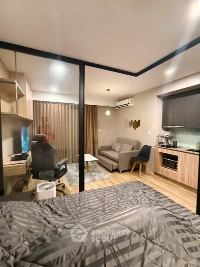 Modern studio apartment with open layout, featuring a cozy living area, stylish kitchen, and comfortable workspace.