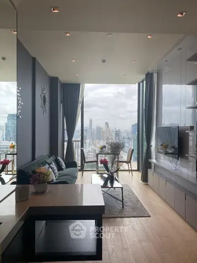 Luxurious high-rise living room with stunning city skyline view, modern decor, and floor-to-ceiling windows.