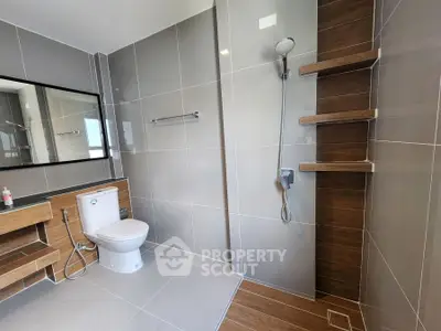 Modern bathroom with sleek tiles and open shower design