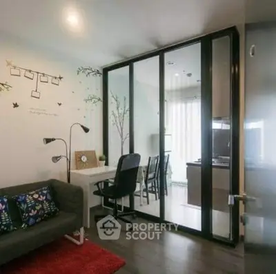 Modern living room with glass partition and stylish decor