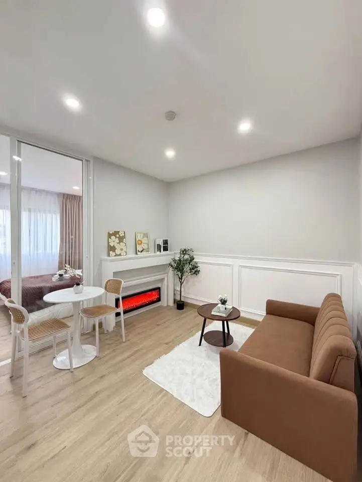 Modern living room with cozy brown sofa, elegant dining set, and stylish decor in a bright, open space.