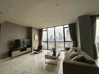 Spacious modern living room with stunning city skyline view and elegant decor.