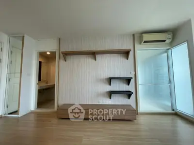 Modern minimalist living room with wooden flooring and wall-mounted shelves