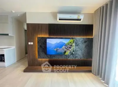 Modern living room with stylish TV wall panel and air conditioning