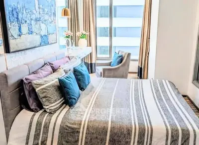 Modern bedroom with stylish decor and large windows in a luxury apartment.