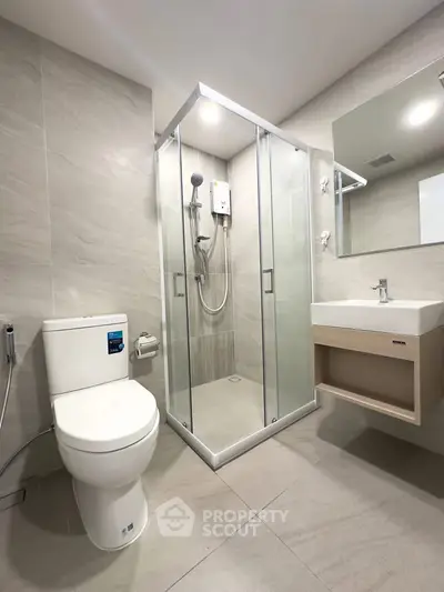 Modern bathroom with sleek shower and elegant fixtures