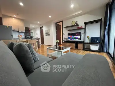 Spacious modern living room with open kitchen and stylish decor