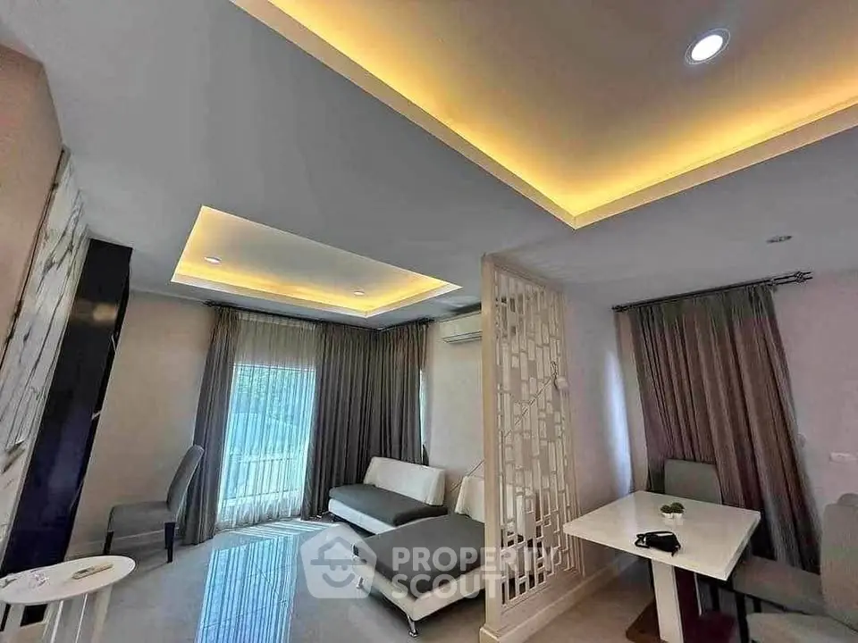 Modern living room with stylish ceiling lights and elegant furniture