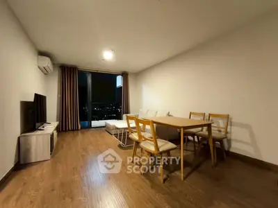 Spacious living room with modern furniture and city view